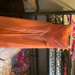 orange/coral prom dress. Was worn for 1 day. it is in excellent condition.